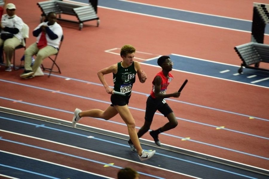 Junior Jake Marks competes in a tight race at the Ed Bowie Classic. The boys finished 2nd in the DMR. 