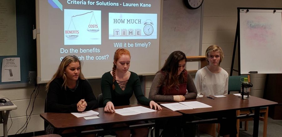 Seniors Polly Litts, Lauren Kane, Keren Peter and Mel Mader present a comprehensive research project on bell times at schools. The classes took part in multiple projects of similar nature throughout the semester.
