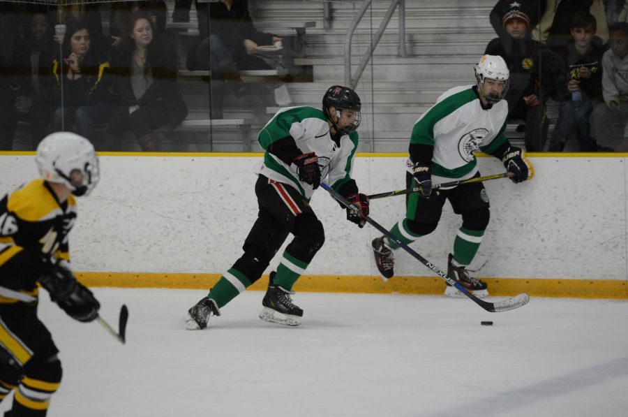 Junior defenseman Michael Greene starts an attack during a game against Richard Montgomery. The Ice Cats won the game 4-0 to cap off the 2017-2018 season. 