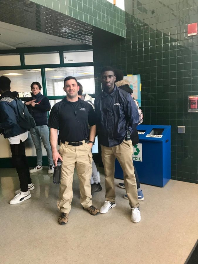 Security guards Kyle Peterson (left) and Alieu (Ali) Tunkara (right) monitor the halls as students leave the school at the end of the today. The two new recruits joined Walter Johnson High School’s security team this year on January 3. 