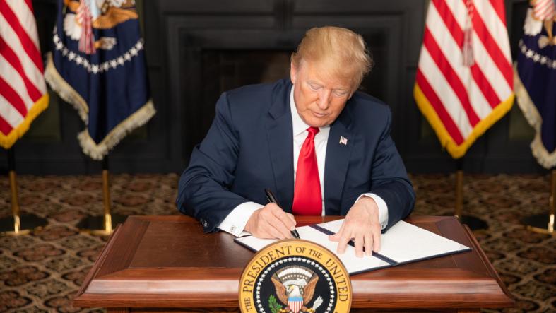 President Trump signs an Executive Order in early August to reimpose sanctions on Iran. Trump elected to withdraw the US from the Iran nuclear agreement in May, among other controversial decisions.