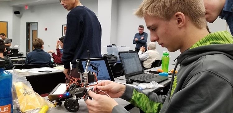 WJ students practice building robots at one of the club’s meetings. The Robotics Club meets every week to prepare for the BotBall Robotics Competition and teach participants about programming and engineering.