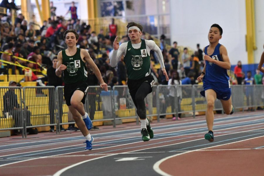 Sophomore Ben Cope (left) and Junior Declan Stablow (middle) spring into action for WJ. Both the boys and girls teams performed well at the Last Track to Philly meet and MCPS Championships.