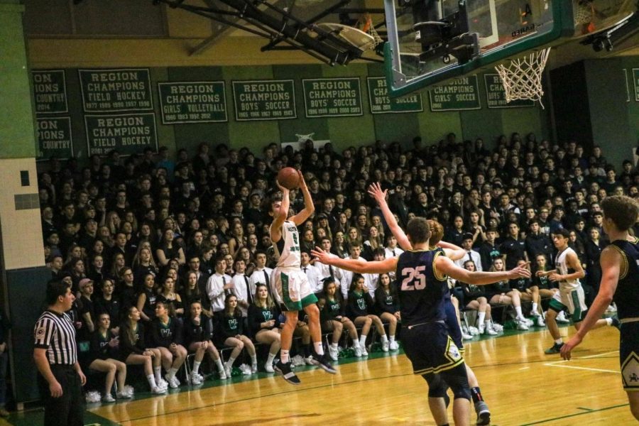 Senior forward Hank Roll pulls up for a baseline jumper in the win over B-CC. Roll came up with timely baskets in this back-and-forth matchup.