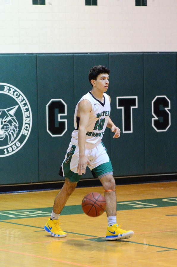 Sophomore guard Philip Stubin brings the ball upcourt in an early season game against Richard Montgomery. Stubin, second on the team in scoring, has stepped up this season and was critical to the teams spectacular regular season.