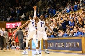 Potential number one and two draft picks Zion Williamson (#1) and RJ Barrett (#5) celebrate at a sold-out Duke basketball game. 