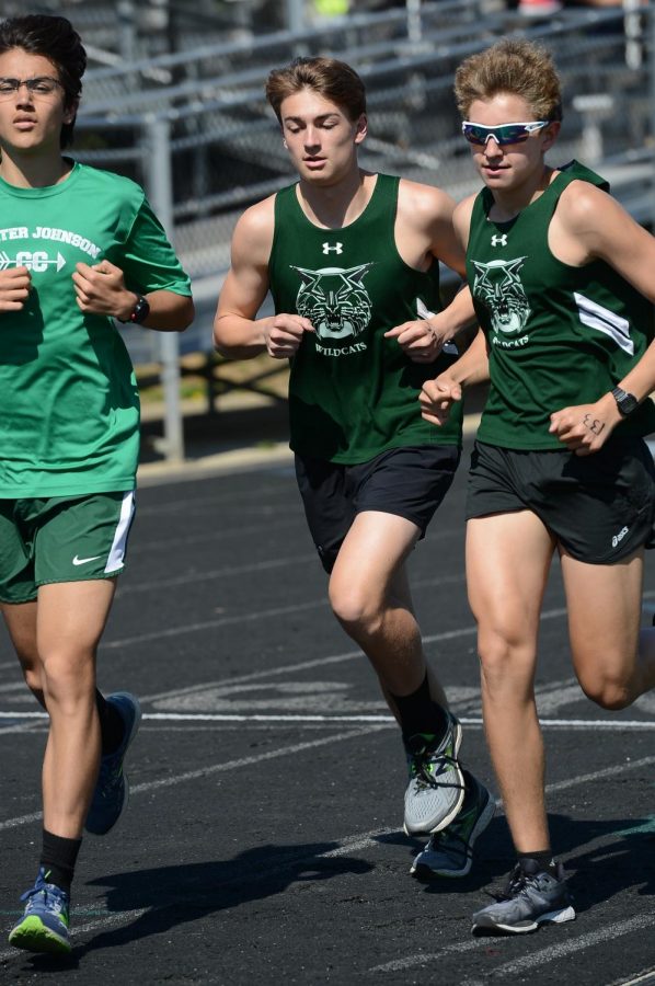 Senior Rodrigo Yepez-Lopez, sophomore Alex Scott and junior Jake Marks (pictured left to right) accelerate through a turn. This trio has led the boys team to a characteristically strong start to the season.