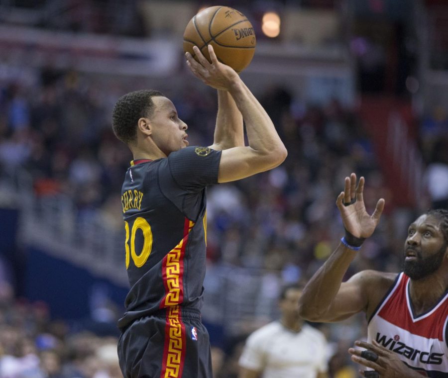 Stephen Curry takes a shot in a game against the Wizards. Curry looks to keep up his great postseason play and lead the Warriors to a third straight title. 