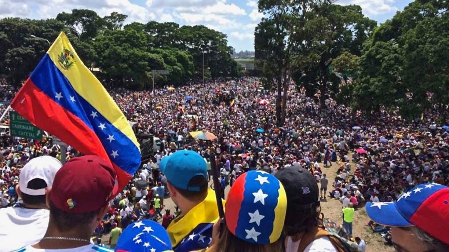 Juan Guaido supporters gather in Caracas, the capital of Venezuela.  Guaido declared himself interim president on January 23, a move that sparked controversy within and outside of the country. 