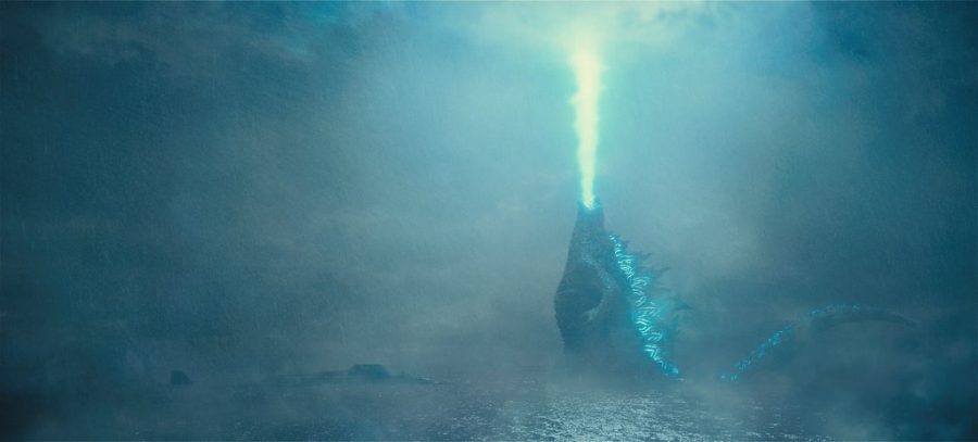 Godzilla emerging from the waves and breathing his iconic atomic breath. Godzilla: King of the Monsters features not only the titular kaiju, but three other famous ones, Mothra, Ghidorah, and Rodan. 
