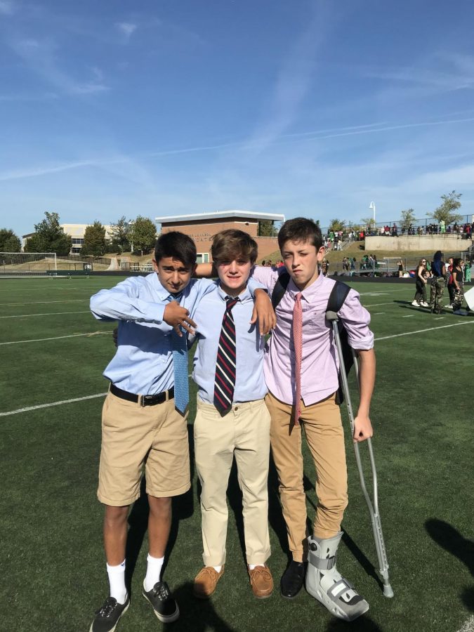 Freshmen+Bardia+Hormozi+%28left%29%2C+Sean+Blakeslee+%28middle%29%2C+and+Sammy+Gramlich+%28right%29%2C+complete+their+very+first+high+school+pep+rally.