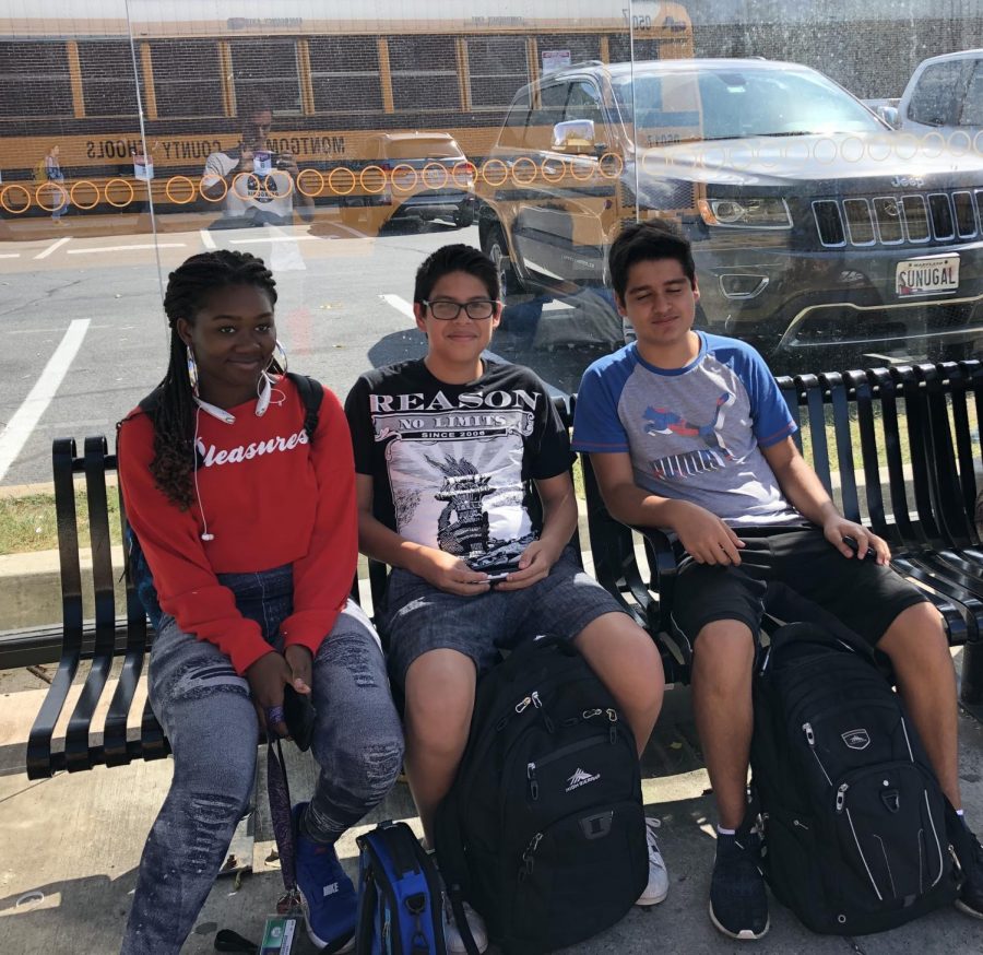 Students wait at the Ride On stop outside of Georgetown Square. A significant amount of WJ students use the bus for after-school transportation, which is already free with a student ID.