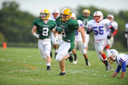 A Damascus football player sprints up the field during a game. The Damascus football program has been under fire lately, having to forfeit their first game of the season due to the holding of an illegal practice.