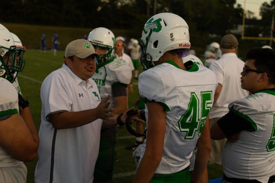 Junior David Gardner discusses strategy with JV coach Cody Chatham. Chatham works alongside head coach Larry Hurd.