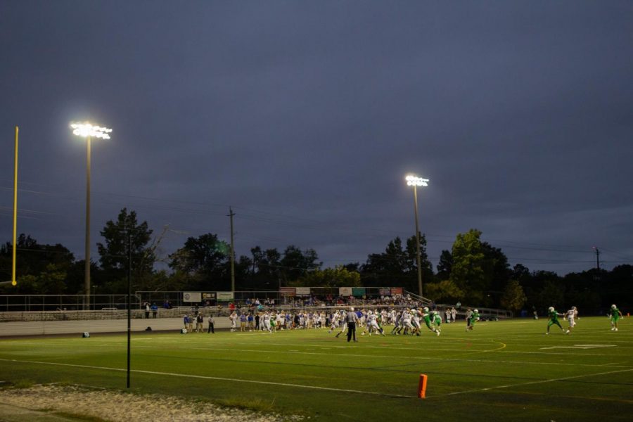 Friday+night+lights+shine+down+on+the+players+as+WJ+football+takes+on+Gaithersburg+at+home.+WJ%E2%80%99s+turf+field+is+set+to+be+replaced+at+the+end+of+the+season.