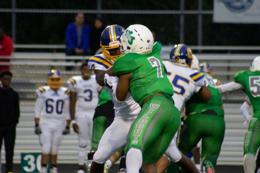 Junior running back Aaron Jones sprints down the field for a touchdown against Clarksburg. Jones led the team to a 41-28 victory with multiple rushing touchdowns to his name.