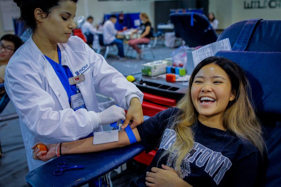 Senior Gwen Rodriquez gets her blood taken by an Inova doctor. Inova has been taking WJ blood donations for a number of years.