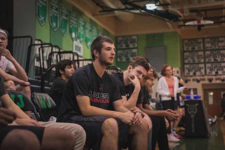 Senior+Matthew+Lewton+watches+the+game+from+the+student+sidelines.