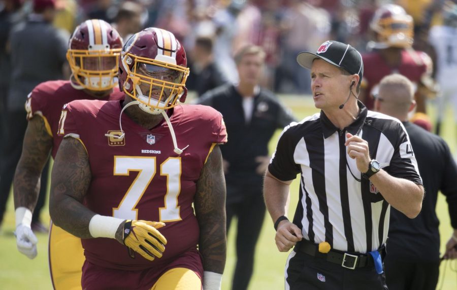 Longtime Redskins captain and fan favorite Trent Williams speaks to an official during a game. After a medical misdiagnosis, Williams has not played this season for the Redskins and has vowed to never return.