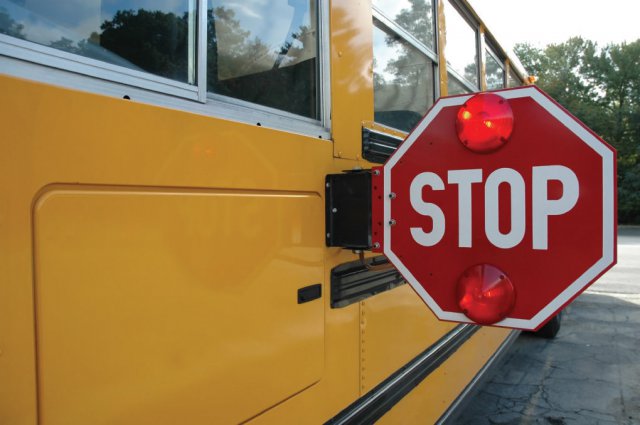 School+buses+are+equipped+with+stop+signs%2C+red+flashing+lights+and+cameras.+The+driver+stayed+on+the+scene+after+the+incident.