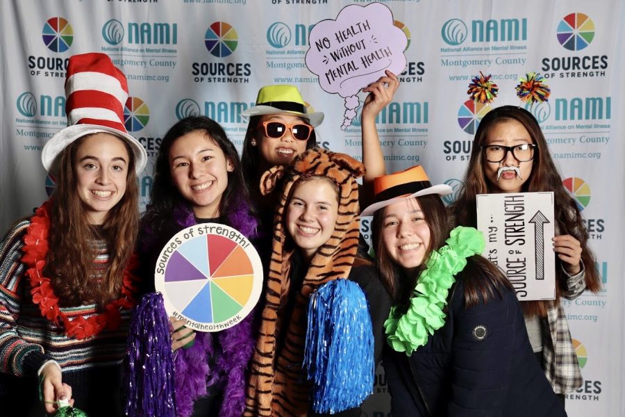 Juniors Emmie Maisel, Mia Chai, Victoria Rentsch, Nicole Uhl, Ella Mochizuki and Amber Liang pose for a mental health-themed photo booth. This event was hosted by Sources of Strength as a fun activity for students during Mental Health Week.