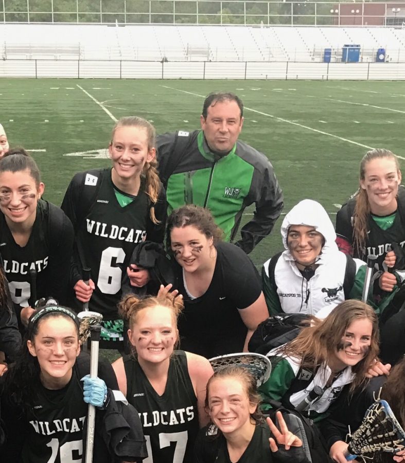 Former coach Gary Reburn with the girls lacrosse team at a game. Reburn, who was coach up until spring 2018, has been charged with attempted kidnap and murder. 