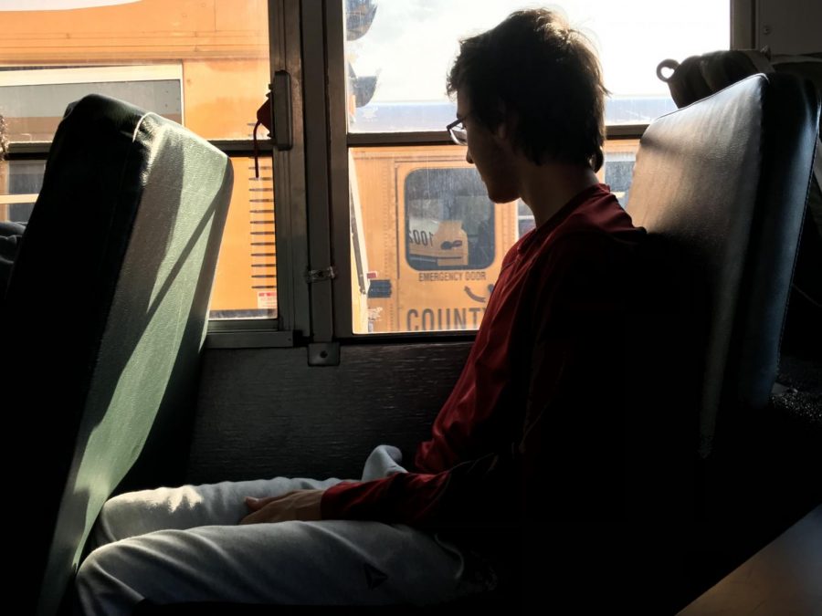 Junior Kai Svenson looks out the window on an MCPS bus. Over the next few years, seatbelts will be added in either the lap or shoulder position.