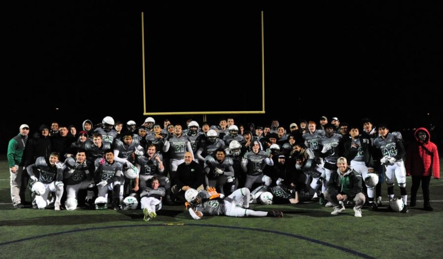 The+varsity+football+team+poses+for+a+picture+following+their+42-10+win+in+the+first+round+of+the+playoffs+against+Urbana+on+Friday%2C+November+8th.