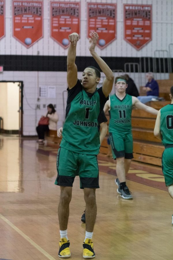 Mikel Fornwald takes a shot on the court at Quince Orchard High School in what ended up a 69-64 WJ win.