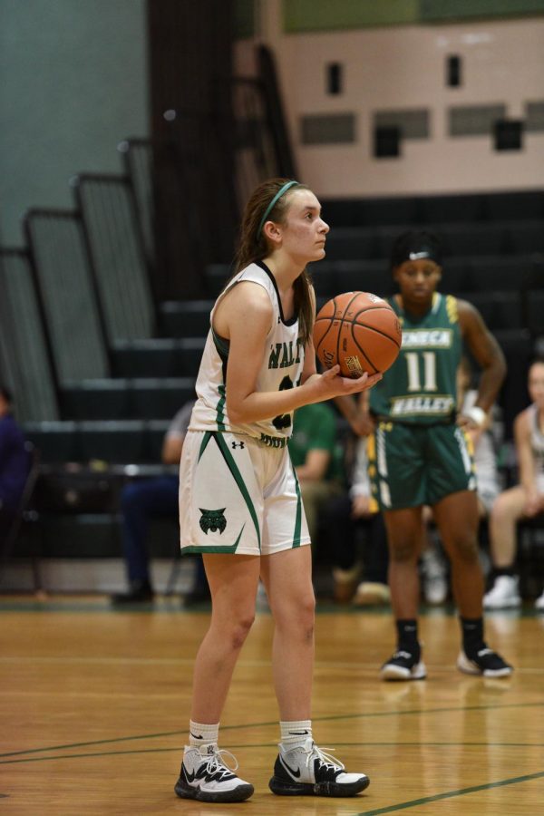 Sophomore Alexa Hackmann lines up for a free throw against the Seneca Valley High School Eagles. Hackmann started the season on JV, but due to the struggling varsity team, was pulled up in mid December.