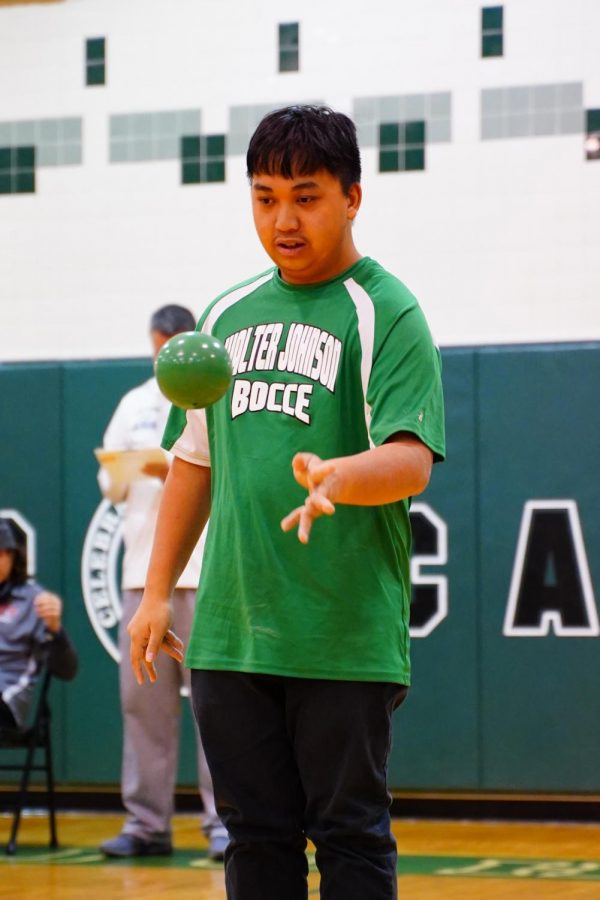 Senior Jomel Velasquez rolls the ball in hopes of scoring a point for his team. As a returning player, he knows the game and hes a leader to the newer players.