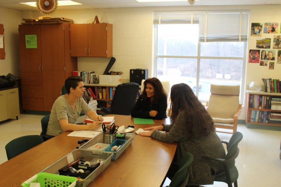 Three math teachers have a discussion their department office during third period. When teaches are not in their class, they are often in their break room.