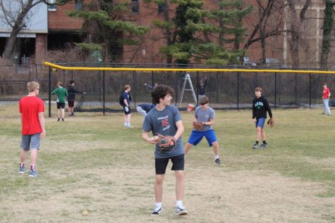 Boys baseball practices throwing as they prepare for their upcoming spring season. The team looks to continue their success from last season.