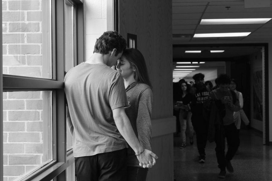Two students steal time to rekindle their romance. While this choice is favored by the couple, not all passer-bys appreciate the PDA.