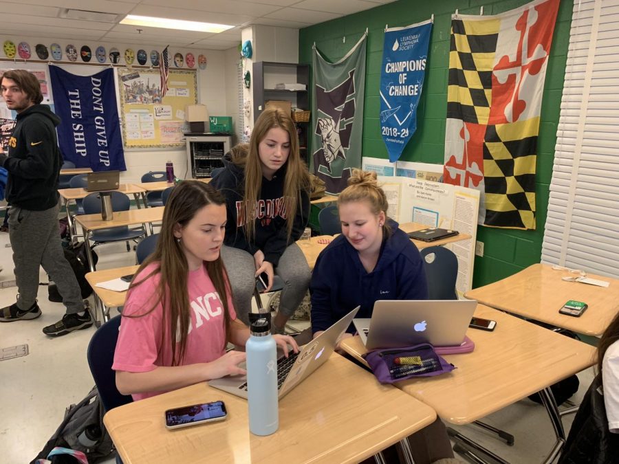 Seniors Meghan Rinehart, Geneva Smith and Leah Bregman (left to right) hard at work planning this years Bachelors event. The fundraiser hopes to raise money for Pennies for Patients through date auctions.