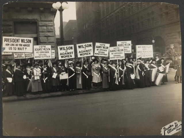 In+1916%2C+Suffragists+protest+outside+Woodrow+Wilsons+meeting+in+Chicago+for+the+right+for+women+to+vote.+The+ratification+of+the+19th+amendment+took+72+years+of+non-violent+protest.