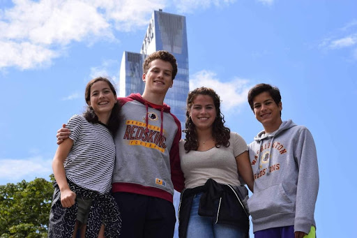 Rachel (class of 24), senior Thomas, class of 17 alum Margaret and sophomore Alex enjoy a beautiful day in New York City this past summer. Theyve all maintained close bonds with each other.