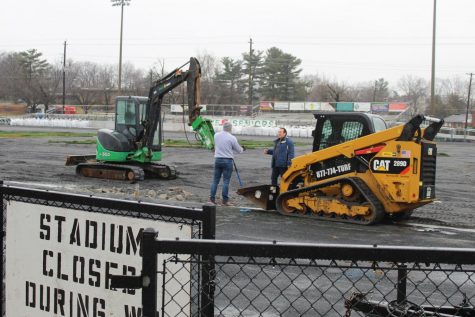 Construction workers discuss the nest step in replacing the turf. In the meantime, the stadium is closed off until the construction is finished. The construction  has caused many inconveniences for students, especially because it is closed off an entrance from Democracy Blvd.  