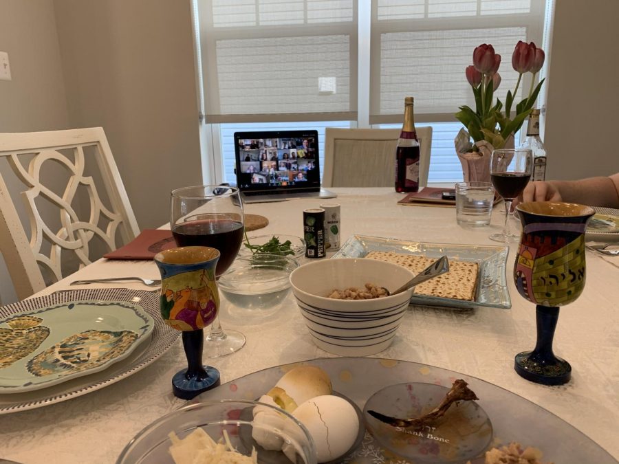 The Renbaum Family celebrates Passover at their home, but have a computer open with their cousins on the screen. Due to COVID-19, Passover seders were held over Zoom to spend it with family across the country. 
