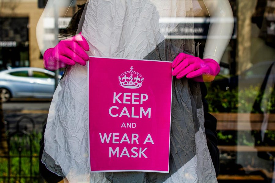 A sign advising people to wear face masks is displayed in a front of a Bethesda store. With cases rising in Maryland, Governor Hogan ordered residents to wear masks at all statewide stores.

