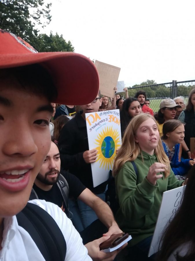 Me sitting in a rally with Greta Thunberg along with other environmentalists.