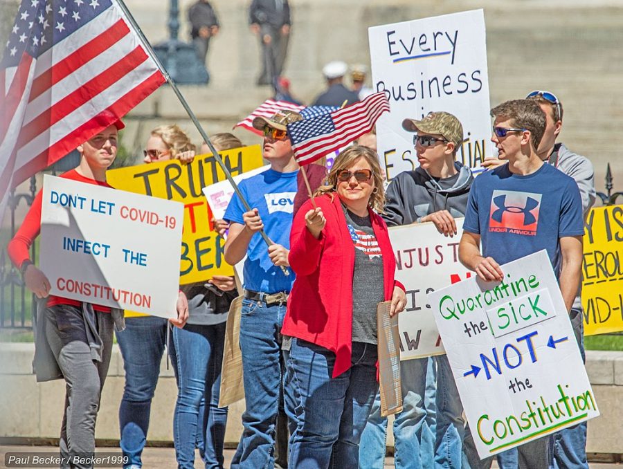 Increasing+amounts+of+protestors+gather+outside+of+state+capitals+protesting+the+lock+down+orders