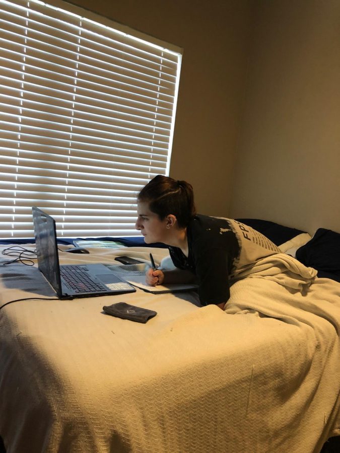 WJ class of 2020 alumni Atticus Goodenow takes notes for his online class from home. This is Goodenows first year at the Savannah College of Art and Design (SCAD) and he opted to take classes from home because of COVID-19.