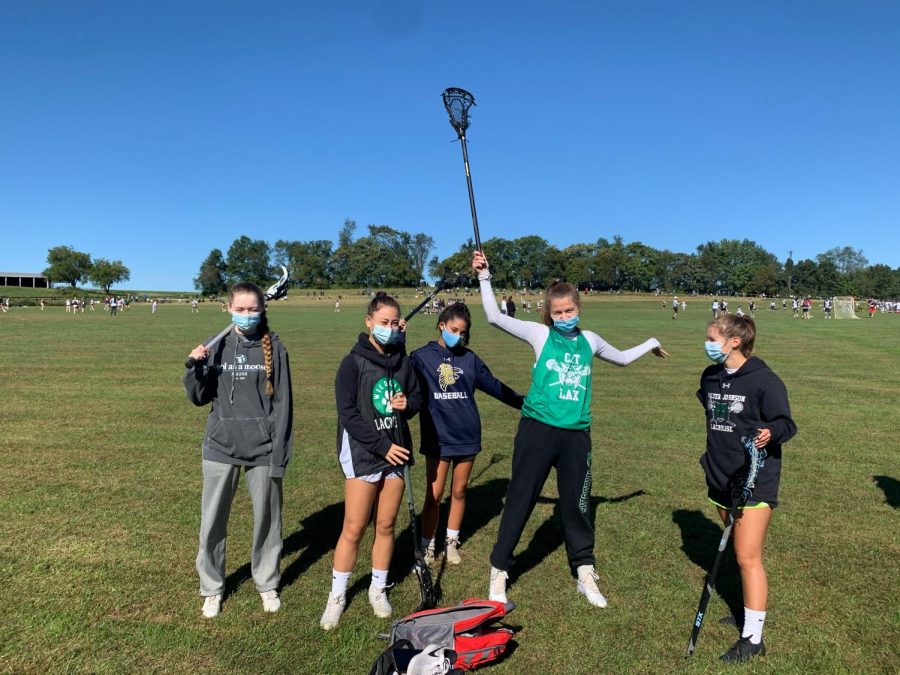 Staying COVID safe, WJ girls lacrosse gets ready to warm up for their Sunday morning game. The girls went on to win 11-6.