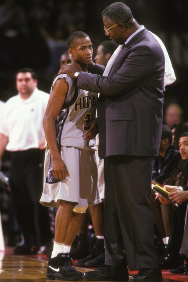 Coach Thompson (right) consoles Hall of Famer Allen Iverson (left) during a game.