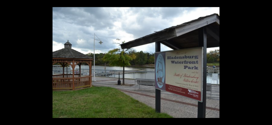 The WJ Crew Club prepares to row on the glassy waters of the Anacostia River at Bladensburg Waterfront Park. This marks one of many socially distanced practices they have planned for the fall season.