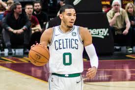 Celtics forward Jayson Tatum takes the ball down the court. Tatum looks to lead the Boston to their first NBA championship win since 2008.