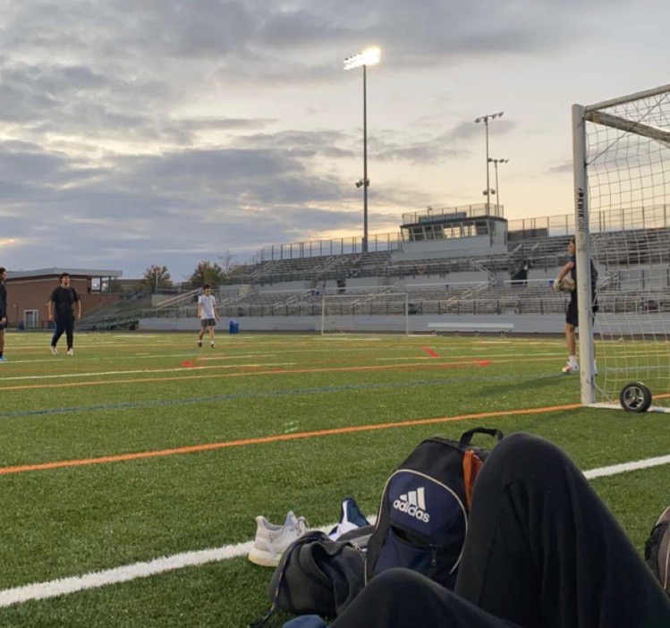 Seniors Marcos Gregorio (left), Ben Files (middle) and Aidan Carr (right) routinely play soccer along with other seniors on Friday or Saturday nights. The new field allows a great place for athletes to train on their own time.