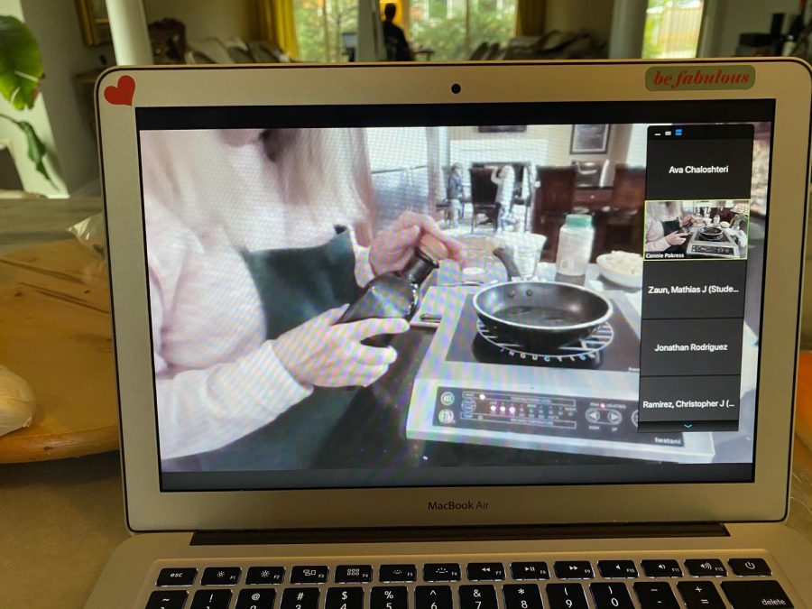 Bon appetit! Senior Ava Chaloshteri watches Connie Pokress make pasta for the class on zoom. I always enjoy her tutorials because it helps me learn new techniques when I cook at home, Chaloshteri said.