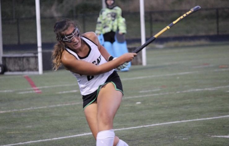 Senior field hockey player Zaniv Chhina clears the ball away from the WJ zone during a competitive contest. ¨My favorite thing about playing field hockey at WJ is being able to go out and play my hardest with my second family, but also anytime we beat BCC, Chhina said.